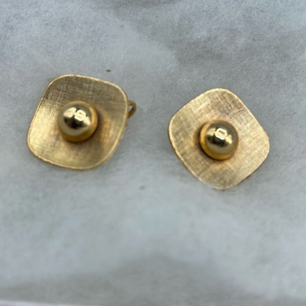 Vintage mid-century Emmons gold colored clip earrings.